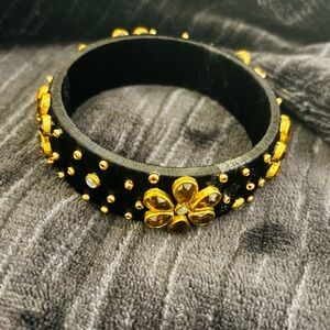 Elegant Black and Gold Floral Bracelet